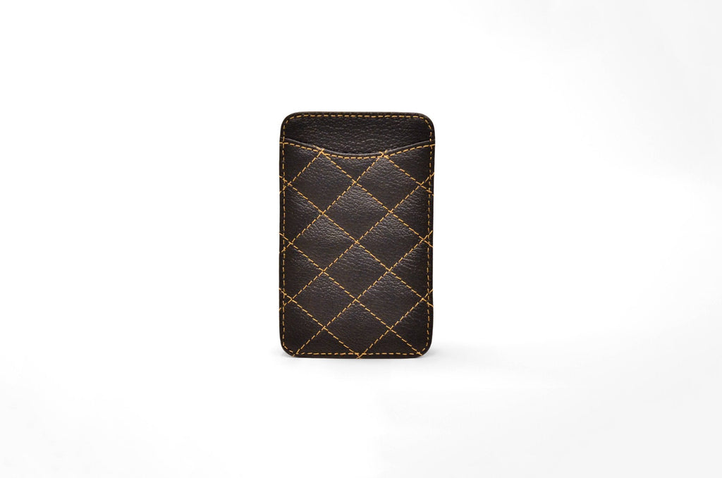 Back view of the black camel leather card holder showing its slim profile and gold stitching