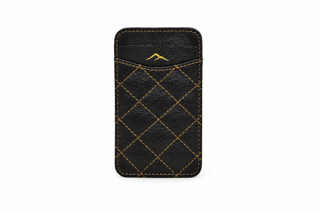 Studio photo of the black camel leather RFID card holder with gold stitching, closed, on a white background