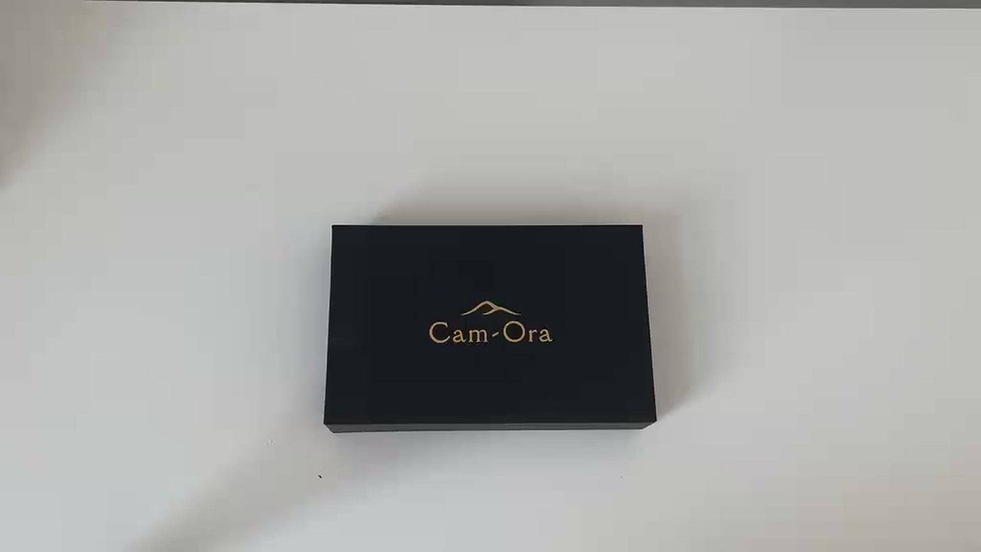 Video demonstrating the camel leather eyeglasses case holding a pair of glasses