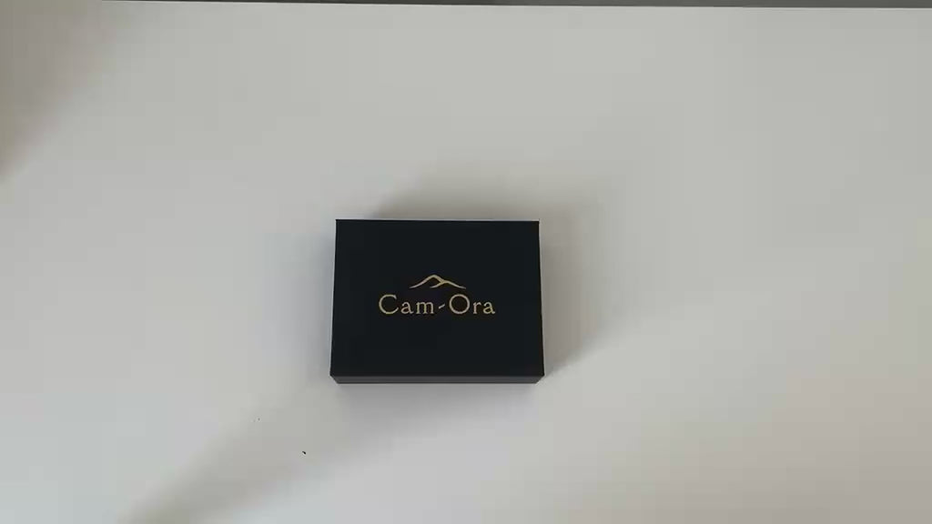 Video of the black camel leather card holder showing its slim profile and card slots